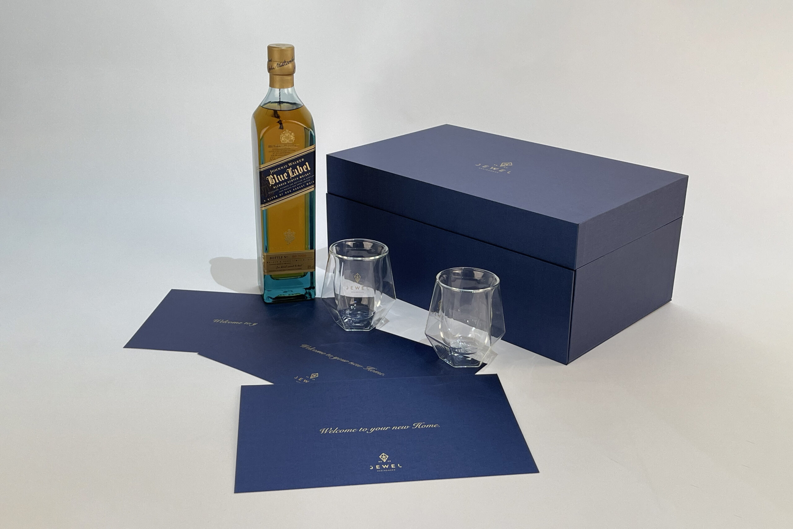 Jewel settlement pack with blue label and drinking glasses.