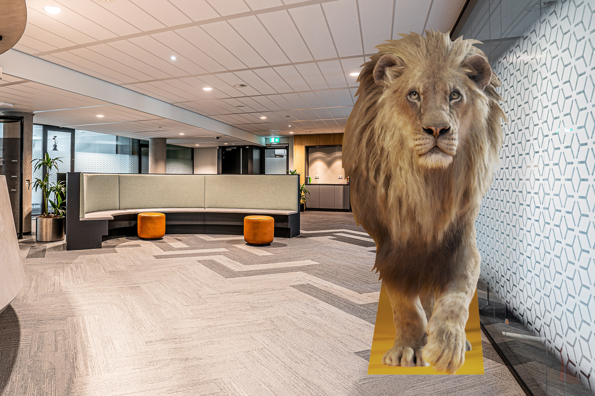Building foyer with Lion standee in front view.